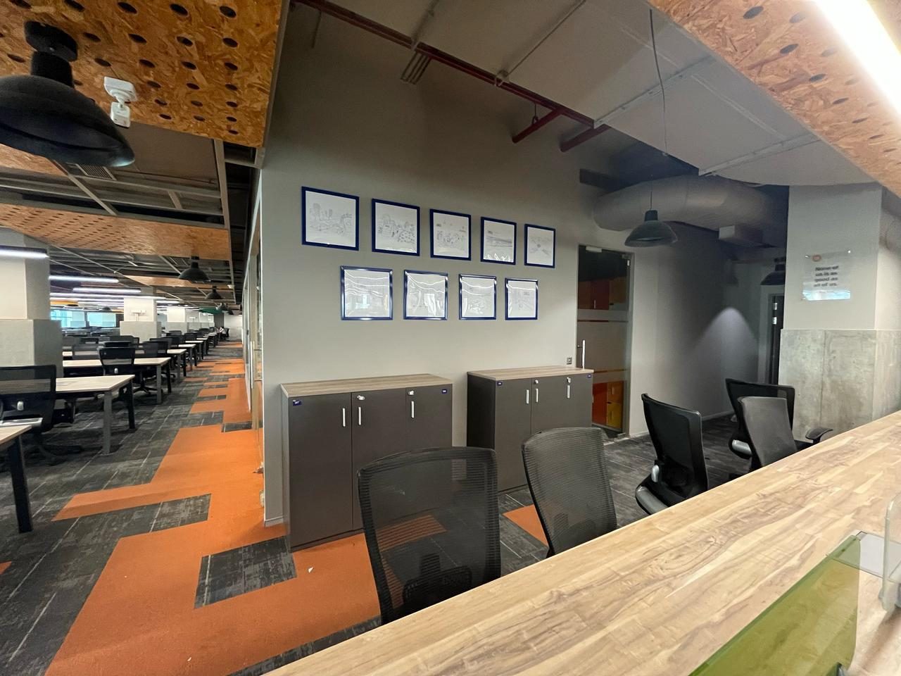 Workstation area with framed wall display