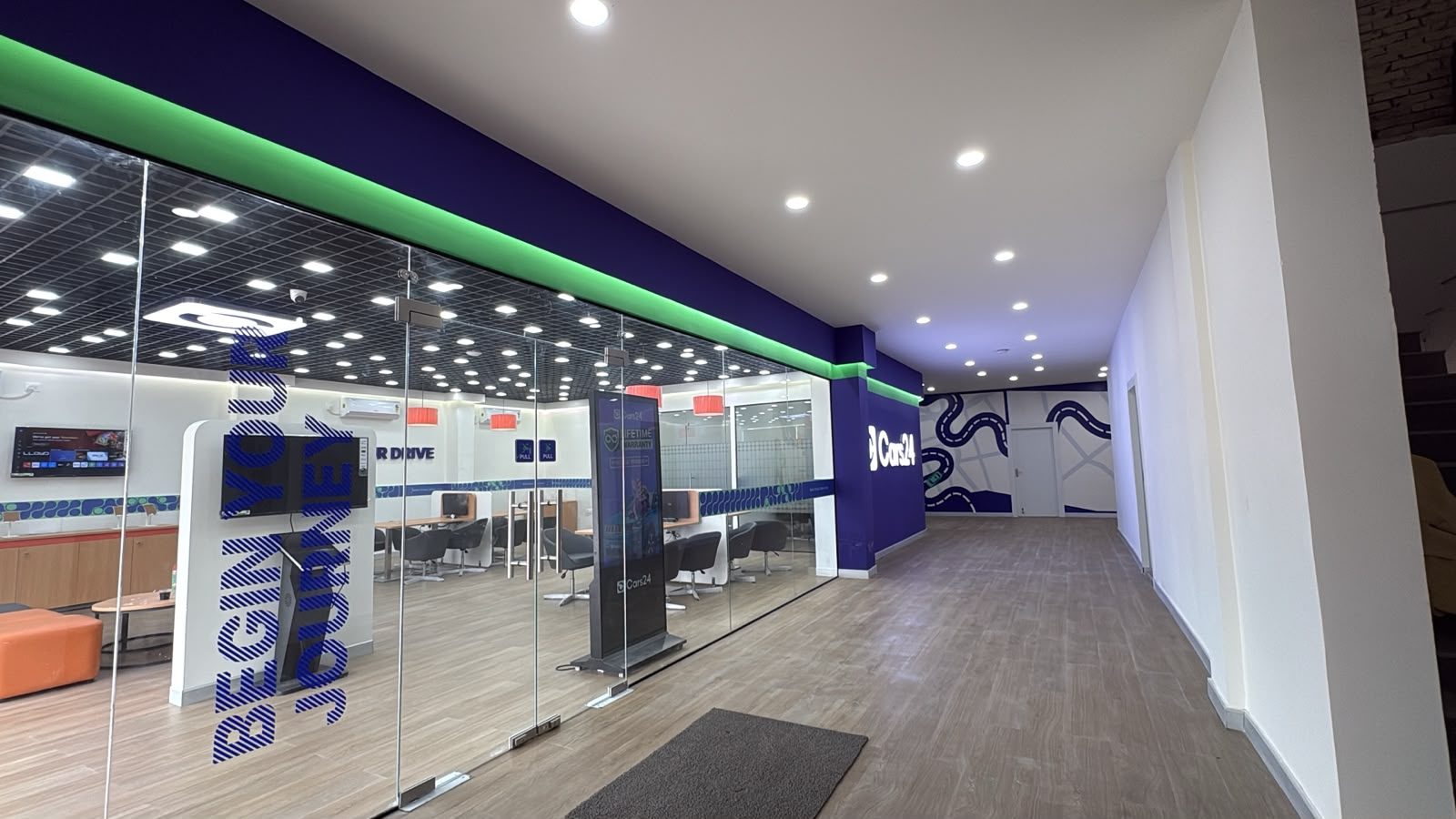 Corridor with CARS24 branded wall graphics