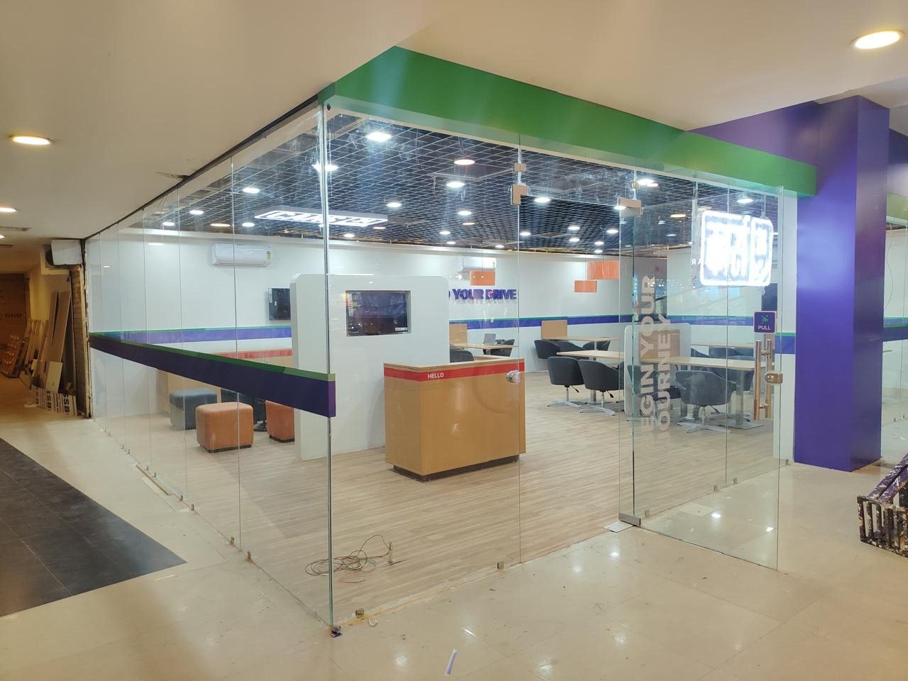 Glass-partitioned meeting area with colour accents