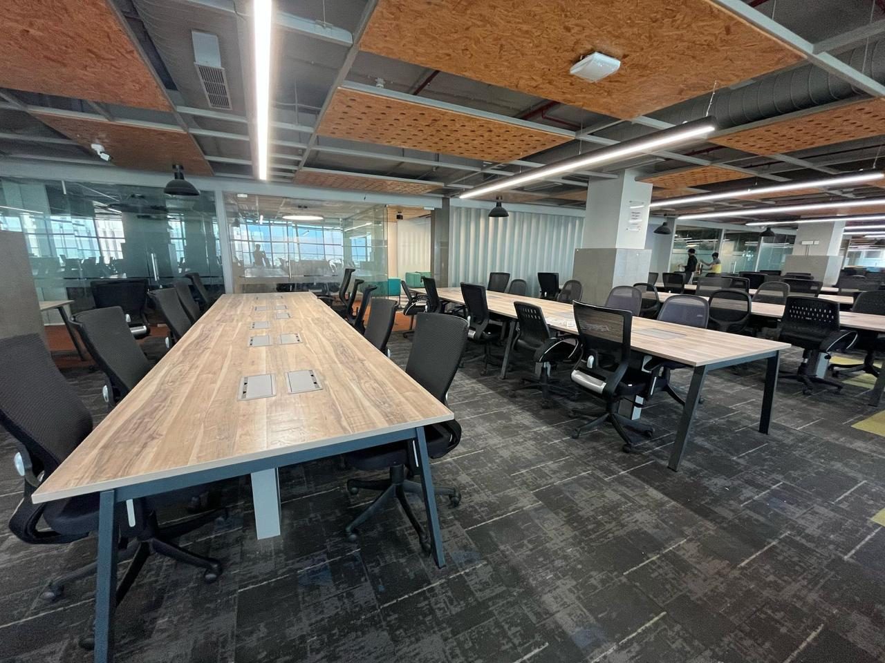 Long workstation table in an open-plan office
